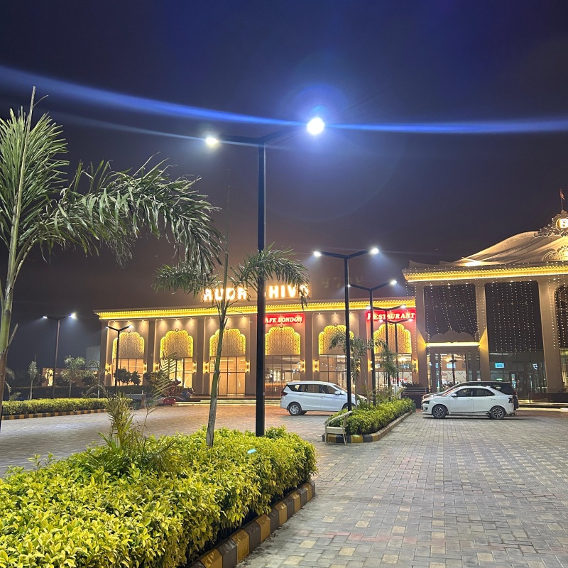 Modern LED street light pole installed in commercial area Delhi India with bright outdoor lighting by Surya Traders